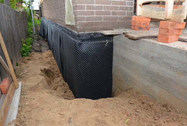 SJ Waterproofing Pros technician performing targeted Vapor Barrier Installation assessment in Elmont, NY